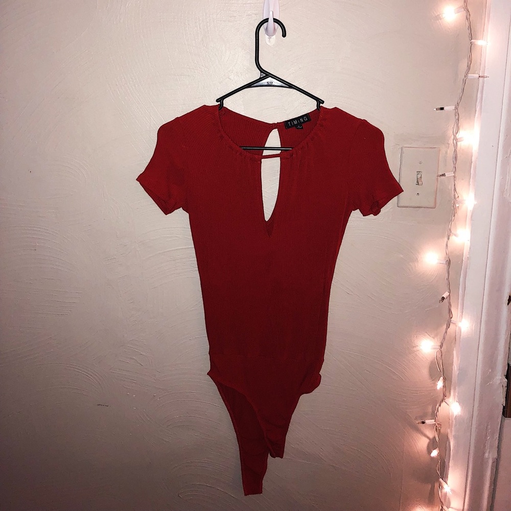 Burnt orange body suit